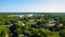 Aerial view of the densely grown green trees against the clear sky in summer