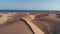 Aerial view - desert and dunes at sunset, on the ocean coast. Maspalomas, Gran Canaria