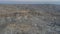 Aerial view of a deserted valley in Luxor. Balloons fly over archaeological excavations.