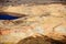 An aerial view of the dikes and terraces at an open pit copper mine.