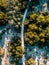 Aerial view of Dirt road in between of lake and sea at serangan beach bali,