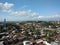 aerial view of a distant downtown neighborhood with beautiful clouds and lots of trees