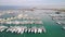 Aerial view of docked sailboats at marina