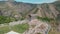 Aerial view dolly zoom out Garni pagan in Caucasus. The hellenistic temple