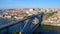 Aerial view of Dom Luis I Bridge and the colorful buildings of Porto under the blue sky