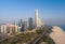 Aerial view of Downtown Abu Dhabi skyscrapers along the city beach on a sunny day, UAE