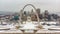 Aerial view of a downtown covered in snow behind Gateway Arch. Old courthouse,  The