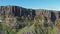 Aerial view of the dramatic coastline at the cliffs by Staffin with the famous Kilt Rock waterfall - Isle of Skye -