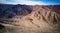 Aerial view on dried river Rio Grande basin on Nazca desert with Nazca lines in the middle, surrounded by mountains.