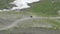 Aerial view of Driver Driving a Sports Atv on the Dirt Road. Atv Rides on Mountain Trail