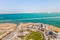 Aerial view from a drone of the beach on the Ein Bokek embankment on the coast of the Dead Sea, the sea itself and the mountains