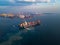 Aerial view from drone, Cargo vessel in beautiful scenic sky.