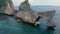 Aerial view of drone flies around wonderful cliff located in the middle of sea