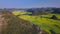 Aerial view drone flight above canola flower field, Luoping, China