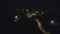 Aerial view from Drone: Night city flying over the road and night lights.