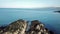 Aerial view of a drone shadow flying over the rocks at Bulls Bay on Anglesey - Wales - UK