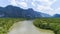 Aerial view drone shot of beautiful natural scenery river in mangrove forest and high mountains in phang nga province Thailand