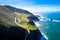 Aerial View Drone Shot of Highway Pacific Coast Highway California USA Big Sur Mountains Ocean Fog Sun