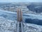 Aerial view, drone shot railway bridge over freezing river. Beautiful panoramic landscape of winter nature