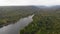 Aerial view drone shot scenic landscape tropical nature tree forest against a mountain and big river