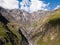 Aerial view from drone to mountains with ravine and fracture near mountain Kazbegi in Georgia