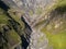 Aerial view from drone to mountains with ravine and fracture near mountain Kazbegi in Georgia