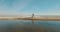 Aerial view from drone of wedding couple walking to each other at the beach. Wedding day. Newlyweds bride and groom.