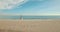 Aerial view from drone of wedding couple walking to each other at the beach. Wedding day. Newlyweds bride and groom.