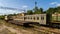 Aerial view dump of abandoned rusty trains and crane among the forest, Chernobyl