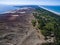 Aerial view with dunes, forest and sea in Curonian spit on a sunny day photographed with a drone.