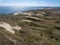 Aerial view with dunes, forest and sea in Curonian spit on a sunny day photographed with a drone.