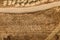 Aerial view of dusty dirt road through grassy plain landscape