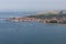 Aerial view Dutch fishing village with offshore windfarm along coast