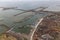 Aerial view Dutch harbor Den Oever with afsluitdijk with sluices