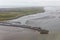 Aerial view Dutch island Ameland with pier and ferry terminal