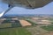 Aerial view Dutch landscape with farmland and wind turbines