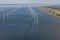 Aerial view Dutch sea with offshore wind turbines along coast