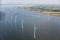 Aerial view Dutch sea with offshore wind turbines along coast