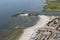 Aerial view Dutch village Makkum with beach and swimming people