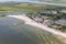 Aerial view Dutch village Makkum with beach and swimming people