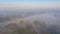 Aerial view of early morning mist over houses, weekend resort in woodland