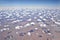 Aerial view of the earth with scattered clouds in blue sky