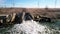 Aerial view. Ecology of fresh water, the stream of dirty water from the treatment plant discharges into a reservoir, Drone shot