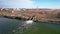 Aerial view. Ecology of fresh water, the stream of dirty water from the treatment plant discharges into a reservoir, Drone shot