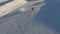 Aerial view elderly man speed riding ski short turning mountain snow. 4k 100fps