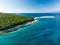 Aerial view of Emplisi Beach, picturesque stony beach in a secluded bay, with clear waters popular for snorkelling. Small pebble