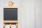 Aerial view of an empty blackboard shaped like an easel on white background