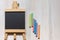 Aerial view of an empty blackboard shaped like an easel on white background