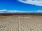 Aerial view of empty dirt road in the arid desert.