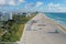 Aerial view of empty South Beach, Florida during COVID-19 beach closure.